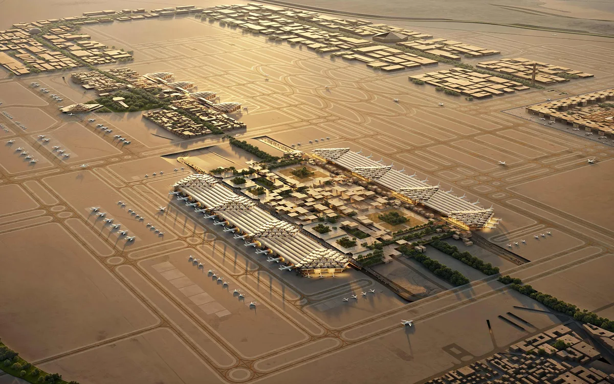 Aerial view of an international airport terminal and aircraft apron